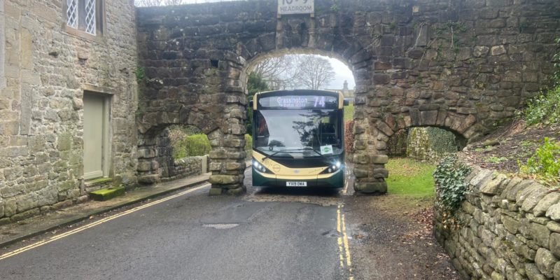 Reliance Motor Services bus under bridge